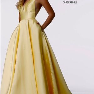Gorgeous yellow Sherri Hill prom dress.  Simple yet beautiful with pockets.